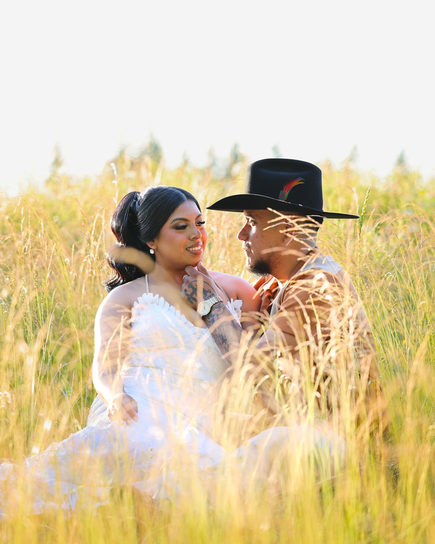 Couple portrait in a field
